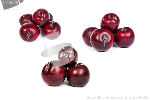 Image of set of Group of plums  on white