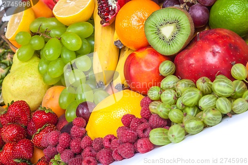 Image of Huge group of fresh fruits isolated on a white background.