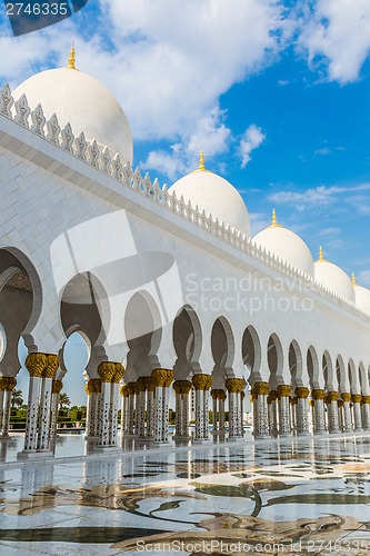 Image of Hallway with golden decorated pillars at the entrance of the wor