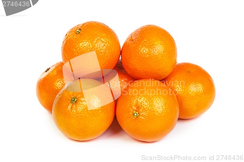 Image of Group of ripe tangerine or mandarin with slices on white