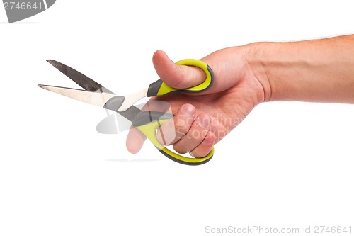 Image of Hand is holding scissors isolated