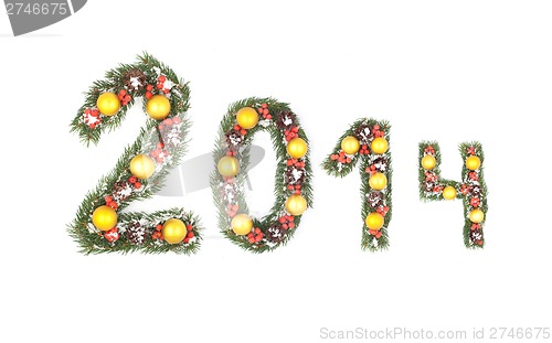Image of 2014 number written by christmas tree branches