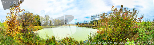 Image of Forest lake in fall. Panorama