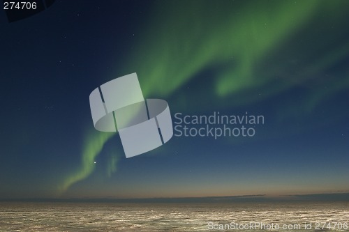 Image of Band of nortern lights over arctic tundra
