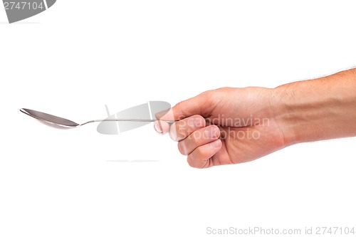 Image of Hand is holding a spoon isolated