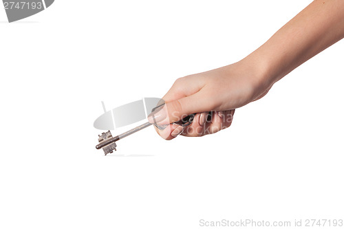 Image of Female hand holding a key to the house