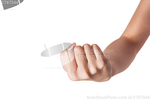 Image of Female hand with a clenched fist isolated