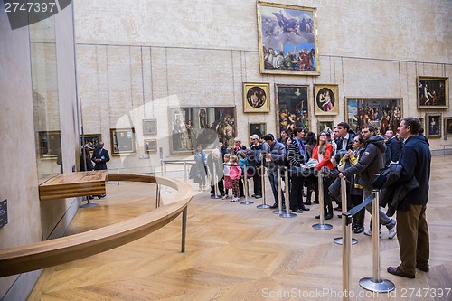 Image of Visitors take photo of Leonardo DaVinci's "Mona Lisa" at the Lou