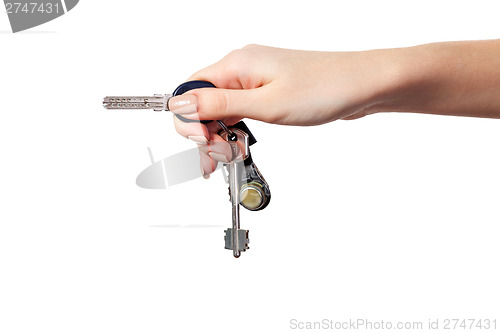 Image of Female hand holding a key to the house