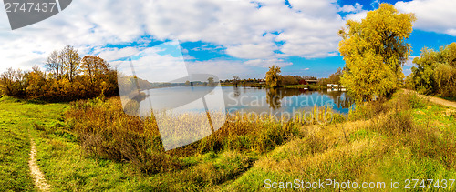 Image of Forest lake in fall. Panorama