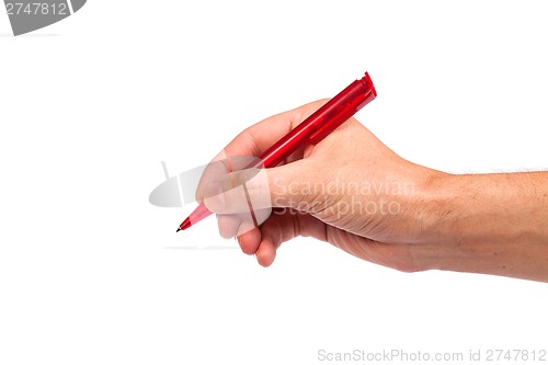 Image of Hand hold a pen writing on the white