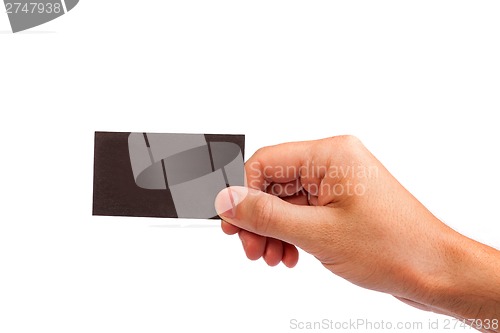 Image of Businessman's hand holding blank business card