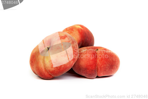 Image of Three ripe fig peach on white