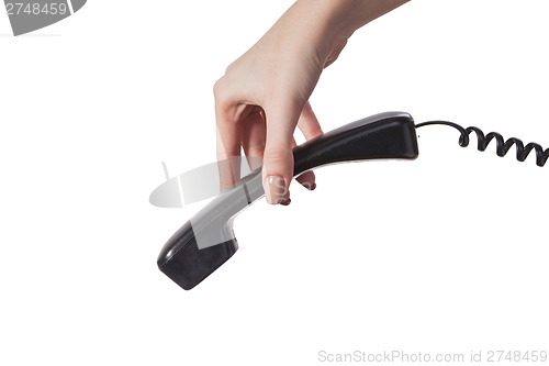 Image of Hand holding an old black telephone tube