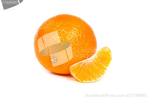 Image of Ripe tangerine or mandarin with slices on white