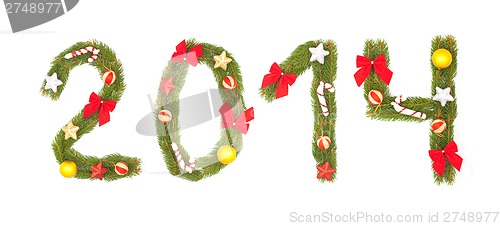 Image of 2014 number written by christmas tree branches