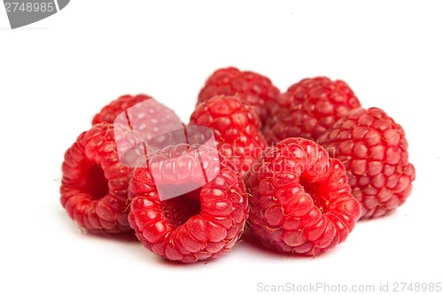 Image of Bunch of a red raspberry on a white background. Close up macro s