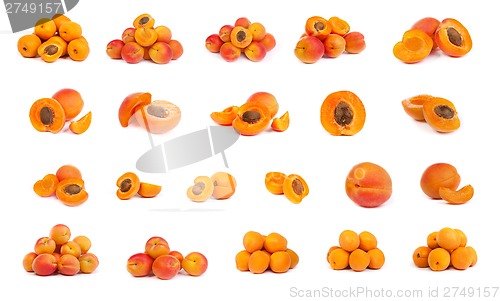 Image of set of ripe apricots with a half