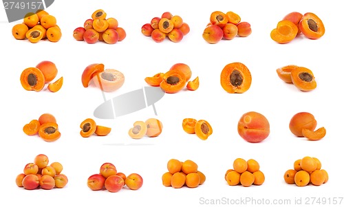 Image of set of ripe apricots with a half