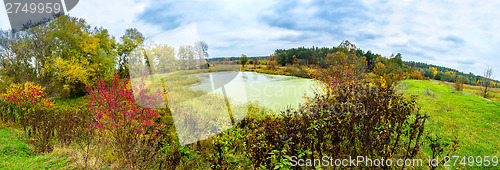 Image of Forest lake in fall. Panorama