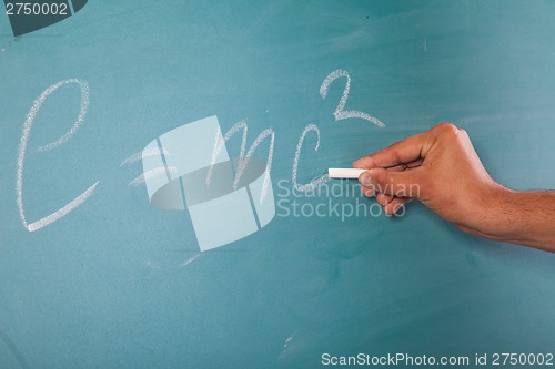 Image of Einstein's Formula E=mc2 on a blackboard