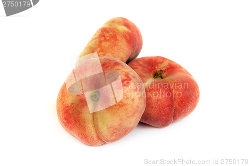 Image of Three ripe fig peach on white