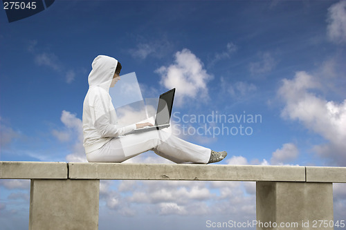 Image of Woman working with is laptop
