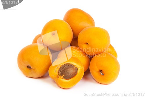 Image of Group of ripe apricots with a half