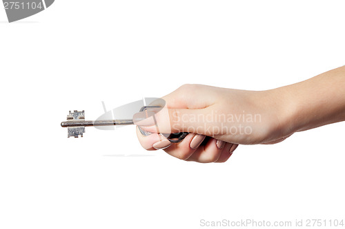 Image of Female hand holding a key to the house
