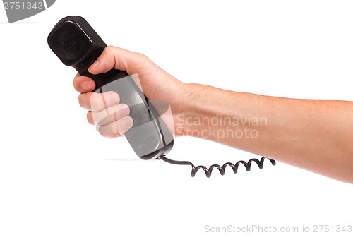 Image of Hand holding an old black telephone tube