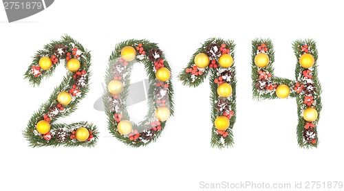 Image of 2014 number written by christmas tree branches