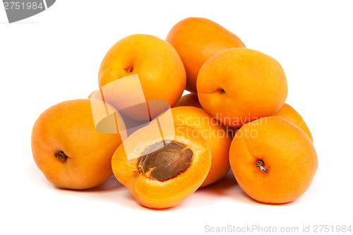 Image of Group of ripe apricots with a half