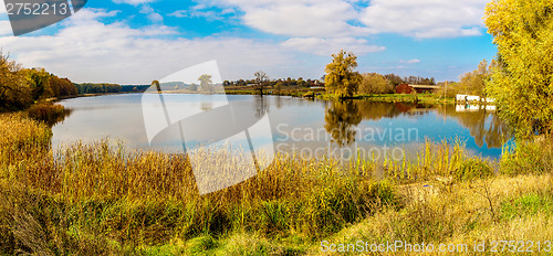 Image of Forest lake in fall. Panorama