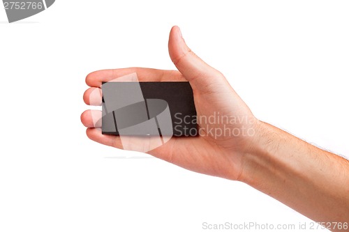 Image of Businessman's hand holding blank business card