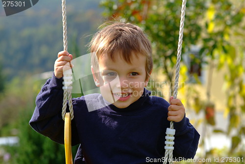 Image of boy on the swing
