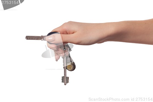 Image of Female hand holding a key to the house