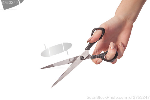 Image of Hand is holding scissors isolated