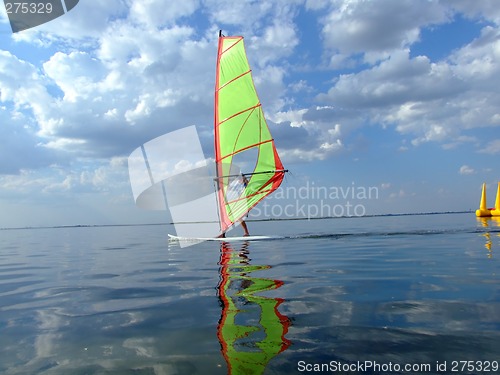 Image of Windsurfer and its reflection in water of a gulf 2