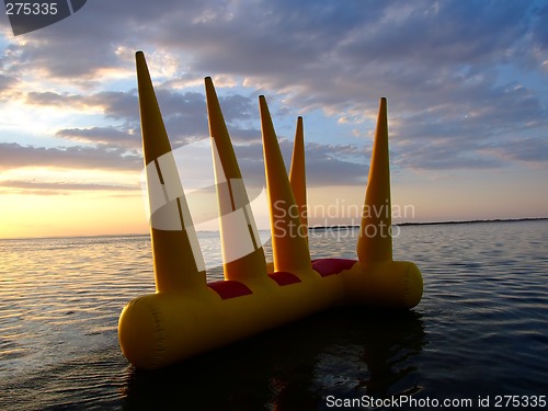 Image of Greater bright inflatable toy on water on a sunset