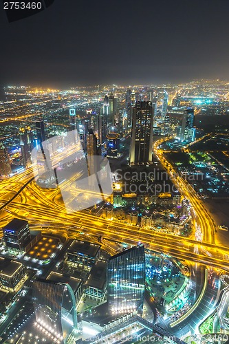 Image of Dubai downtown night scene with city lights,