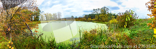 Image of Forest lake in fall. Panorama