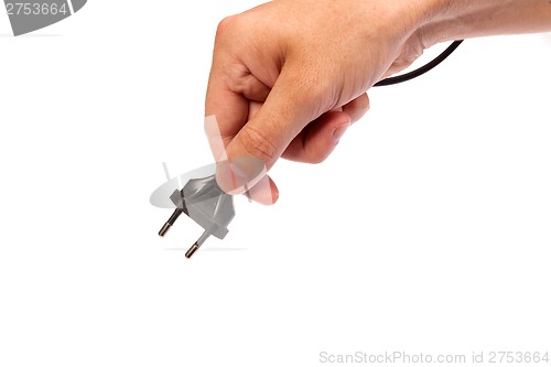 Image of Man is holding a black outlet in the hand