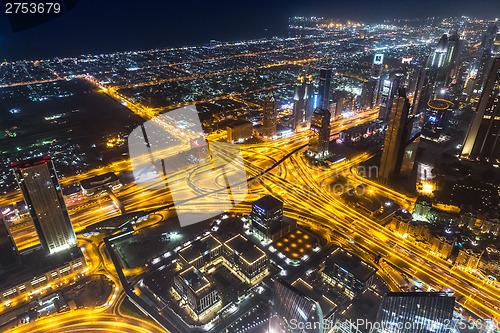 Image of Dubai downtown night scene with city lights,