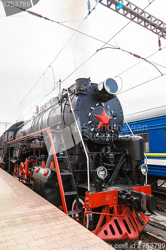 Image of Old steam train is leaving a station