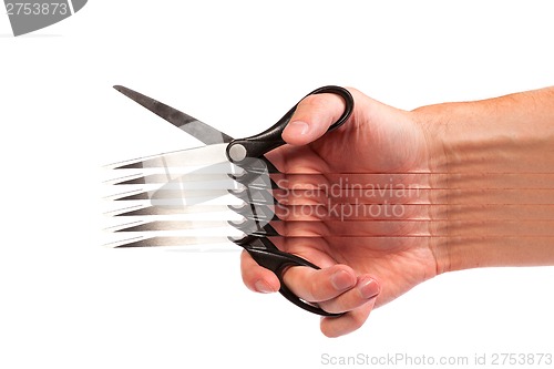 Image of Hand is holding scissors isolated