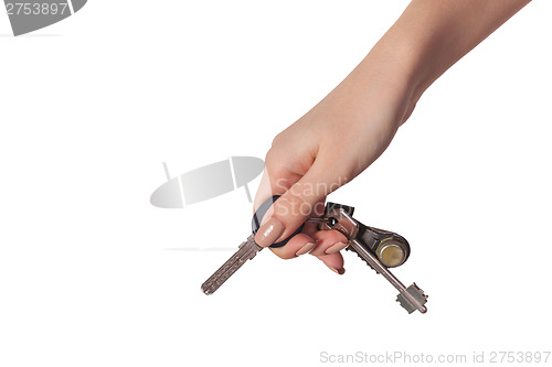 Image of Female hand holding a key to the house