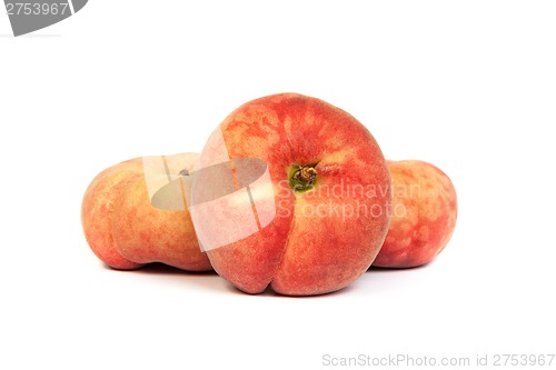Image of Three ripe fig peach on white