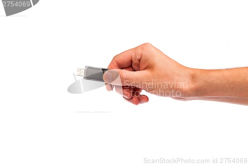 Image of Closeup image: hand holding black USB data storage or connecting
