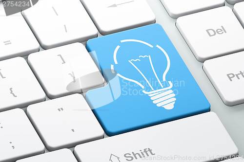 Image of Business concept: Light Bulb on computer keyboard background