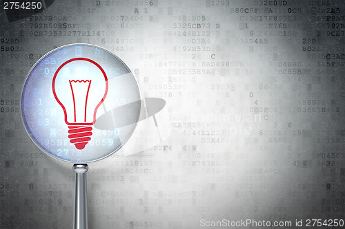 Image of Business concept:  Light Bulb with optical glass on digital back